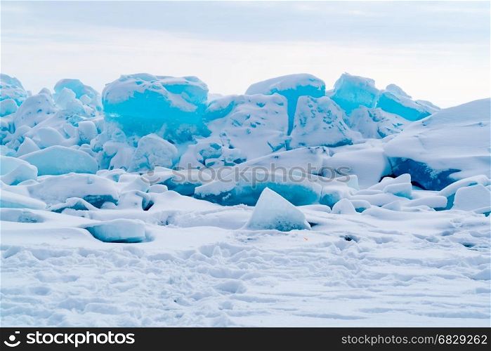 View of ice blocks cover with snow at Frozen Lake Baikal in Russia