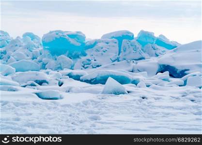 View of ice blocks cover with snow at Frozen Lake Baikal in Russia