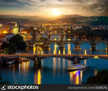 View of illuminated bridges in Prague in evening