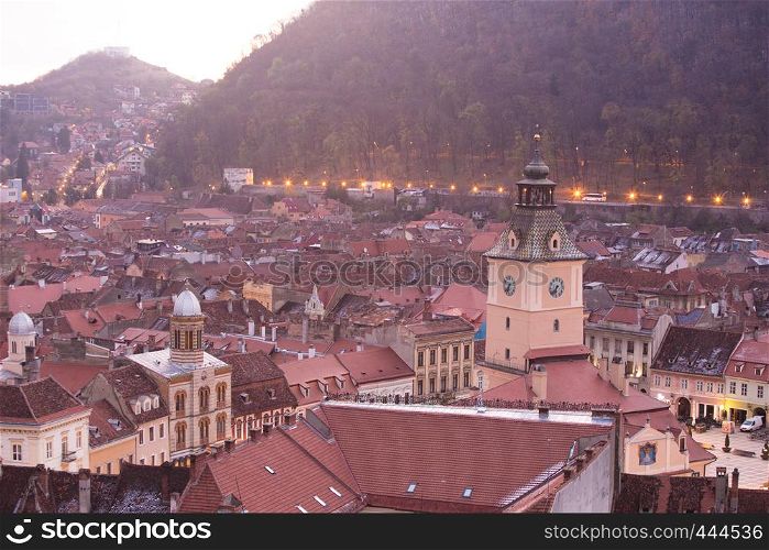 view of illuminated evening ancient town Brasov, Romania