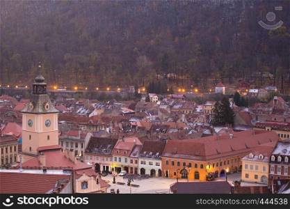 view of illuminated evening ancient town Brasov, Romania
