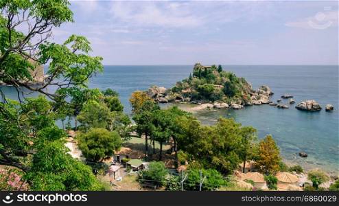 View of island and Isola Bella and blue ocean water in Taormina, Sicily, Italy