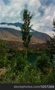 view of Kachura lake with mountain and foliage, Skardu, Gilgit Baltistan, Pakistan.
