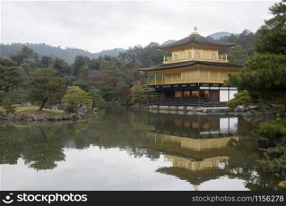 View of Kinkakuji, Temple of the Golden Pavilion buddhist temple in Kyoto. It is one of the most popular buildings in Japan, attracting a large number of visitors annually.