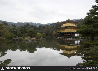 View of Kinkakuji, Temple of the Golden Pavilion buddhist temple in Kyoto. It is one of the most popular buildings in Japan, attracting a large number of visitors annually.