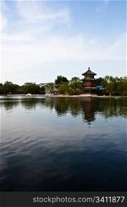 View of lake and ancient tower in Beijing, close to Forbidden City