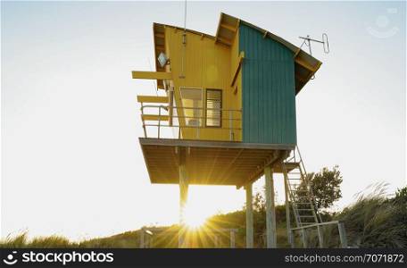 View of Lakes entrance beach and lifeguard rescue station with sunset in Victoria, Australia