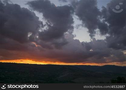 View of landscape against cloudy sky at sunset, Orvieto, Terni Province, Umbria, Italy