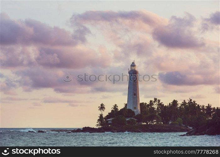View of lighthouse Dondra and lights at sunset Matara, Sri Lanka.