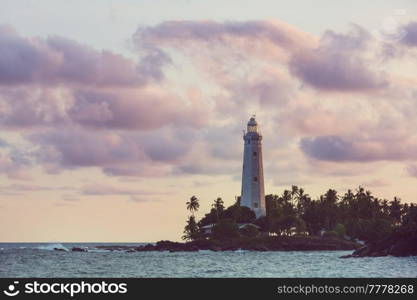 View of lighthouse Dondra and lights at sunset Matara, Sri Lanka.