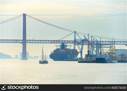 View of Lisbon Industrial port and 25 April bridge. Portugal