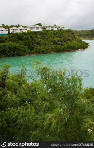 view of Long Bay with resort villas and seascape in Antigua (overcast weather)