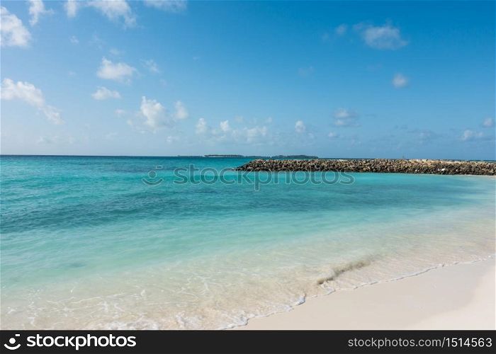 View of Maafushi Island with crystal clear water in the beach, Maldives.