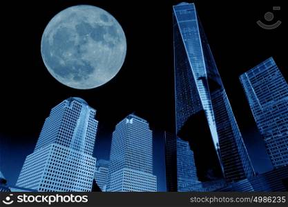 view of manhattan buildings with full moon in blue tone