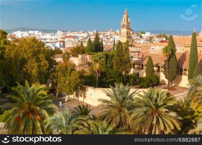 view of Mezquita from Alcazar in Cordoba, Spain. Aerial view of the Torre del Alminar at the Mezquita or Bell tower of Cathedral Mosque from Alcazar in the sunny day, Cordoba, Andalusia, Spain