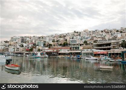 View of Mikrolimano Port in Piraeus, near Athens, Greece, at sunset.