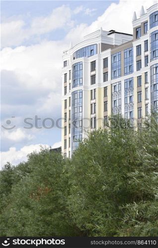 view of modern apartment building in the city and the sky