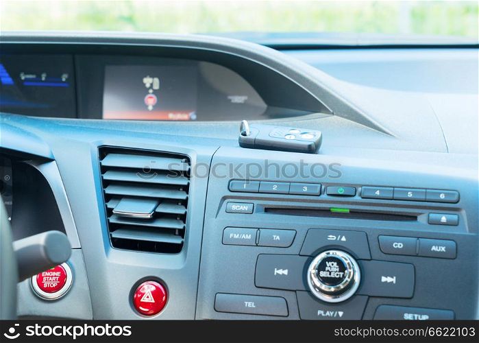 view of modern car dashboard with start power engine and keys. car dashboard with keys