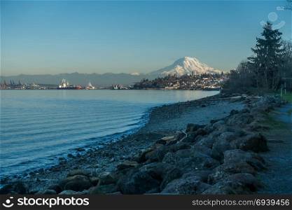 View of Mount Rainier from the Ruston area of Tacoma, Washington. The mountain glows in the evening twilight.