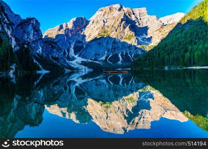 View of Mount Seekofel of the Dolomites and the reflection at the Lake Braies in the morning