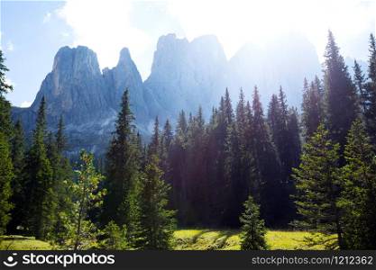 view of mountain Dolomites and the bright sun. Italy.