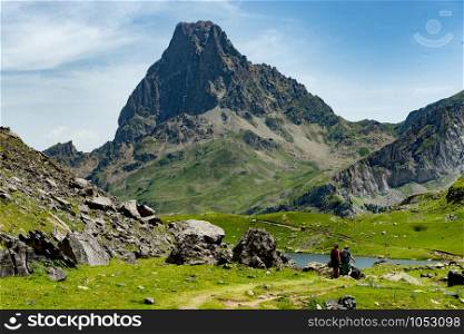 View of mountain the Pic du Midi d&rsquo;Ossau in the French Pyrenees with backpacks