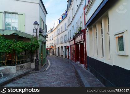 View of narrow street in quarter Montmartre in Paris, France. Cozy cityscape of Paris at summer. Architecture and landmarks of Paris.. cityscape Mont Matre , Paris, France