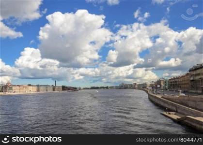 View of Neva river and Voskresenskaya (Resurrection) embankment in St. Petersburg, Russia. Sunny summer day