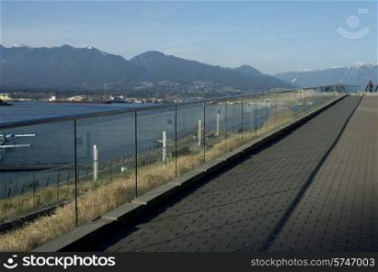 View of North Vancouver with mountains in the background, Coal Harbour, Vancouver, British Columbia, Canada