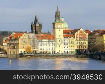 View of old Prague and red tiled roofs and towers of the old town.. Prague. View of the old city.