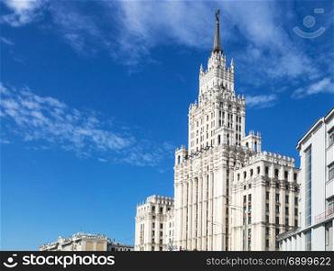 view of old Stalin&rsquo;s high-rise Red Gates Administrative Building in Moscow city under blue sky in sunny autumn day