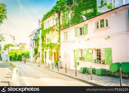 View of old street in quarter Montmartre in Paris, France. Cozy cityscape of Paris at summer. Architecture and landmarks of Paris, retro toned. cityscape Mont Matre , Paris, France