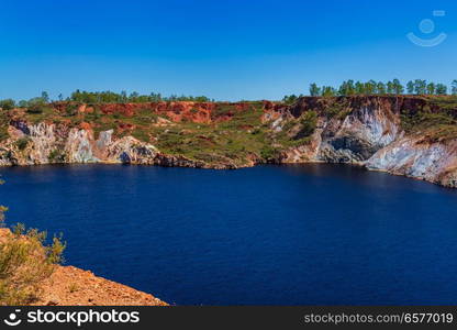 View of old weel now fill with water of the abandoned Mine in Minas de Sao Domingos Village in Alentejo Portugal.