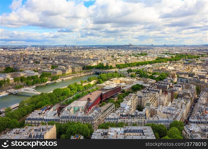 View of Paris, the Seine river and the hill of Montmartre from the Eiffel tower