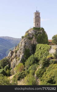 View of picturesque Arachova mountainous village with iconic tower clock in Greece, at the foot of Mount Parnassos, near Delphi.