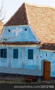 View of picturesque village Viscri in Romania. Painted traditional old houses in medieval Saxon village of Viscri, Romania, 2021