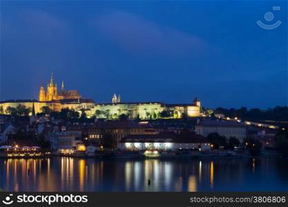 View of Prague by night on the Vltava river