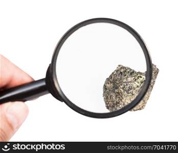 view of raw peridotite mineral through magnifier isolated on white background