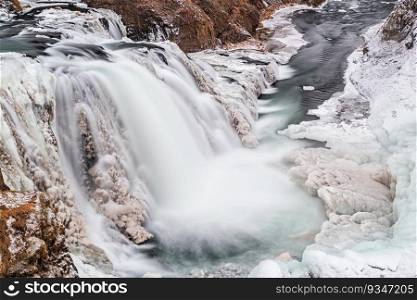 View of Reykjafoss waterfall. Varmahlid river in Northern Iceland in winter. View of Reykjafoss waterfall, Iceland