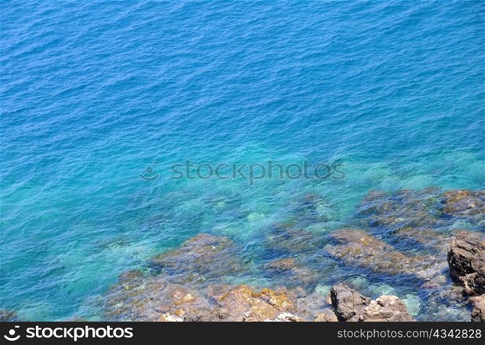 View of rocks and blue waters of the Aegean Sea