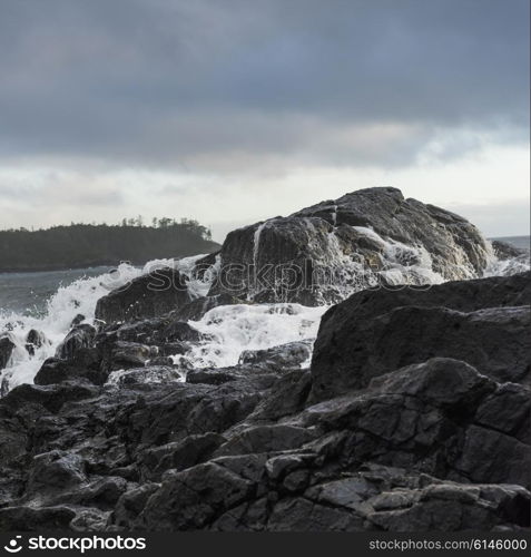 View of rocks at coastline, Pettinger Point, Cox Bay, Pacific Rim National Park Reserve, Tofino, British Columbia, Canada