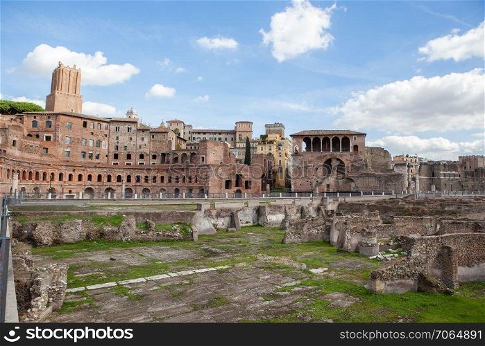 View of Roman Forum, focus on Saturn&rsquo;s Temple in foreground. Ancient roman ruins in Rome, Italy. Historical place of Rome.. Rome City at sunny day