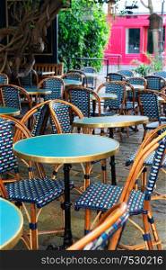 view of romantic Monmartre street with cafe table close up, Paris, France. Monmartre cafe, Paris, France