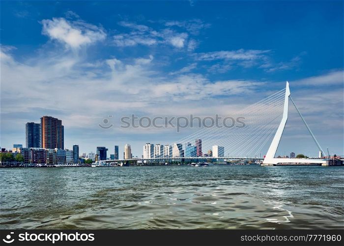 View of Rotterdam skyline over Nieuwe Maas with Erasmusbrug bridge and skyscrapers. Rottherdam, the Netherlands. View of Rotterdam over Nieuwe Maas with Erasmusbrug bridge. Rottherdam, the Netherlands