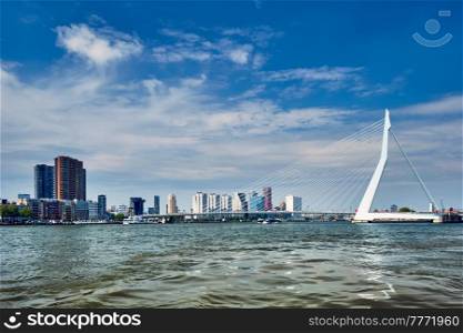 View of Rotterdam skyline over Nieuwe Maas with Erasmusbrug bridge and skyscrapers. Rottherdam, the Netherlands. View of Rotterdam over Nieuwe Maas with Erasmusbrug bridge. Rottherdam, the Netherlands