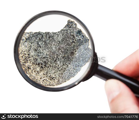 view of rough peridotite mineral through magnifier isolated on white background