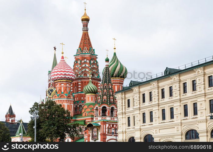 view of Saint Basil Cathedral (Pokrovsky Cathedral) on Red Square of Moscow Kremlin from Varvarka street in september