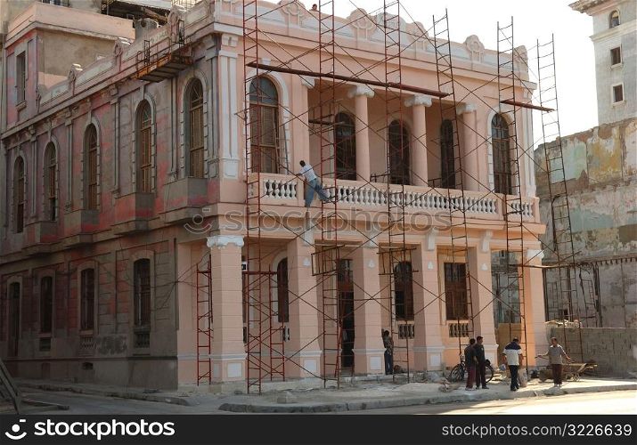 View of scaffolding on the facade of a commercial building, Havana, Cuba