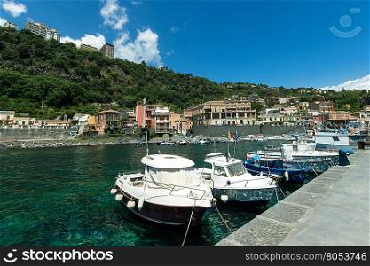 View of Sea port, boats and houses at Acireale - Italy.