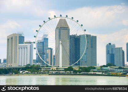 View of Singapore Flyer and modern skyscrapers on background